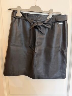 Black Faux Leather Mini Skirt with waist tie. Size 36/Fits like a 6